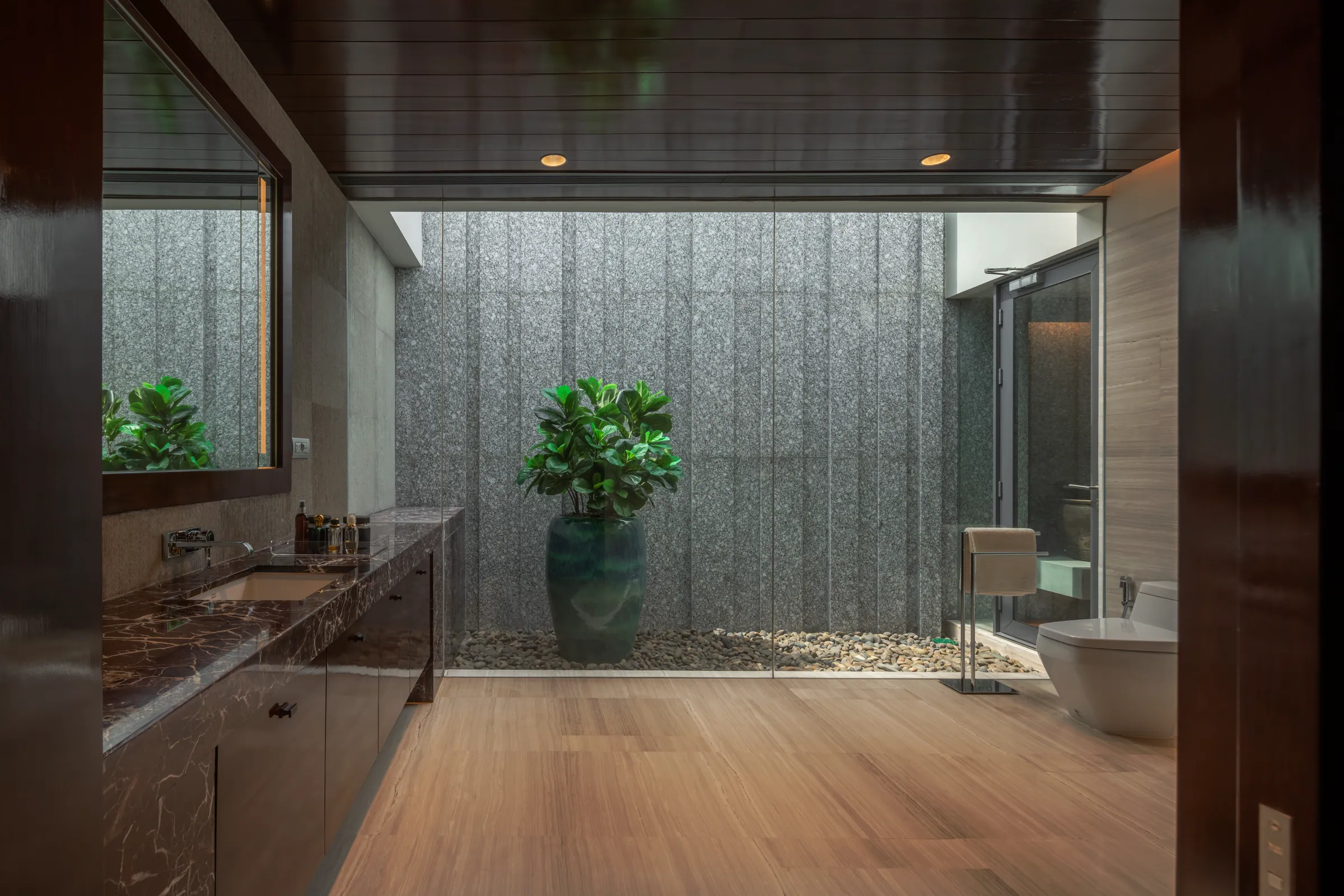 Bedroom 4 at Khon Kaen Residence — spa-like dressing suite with green stone vessel sink and terrazzo flooring.