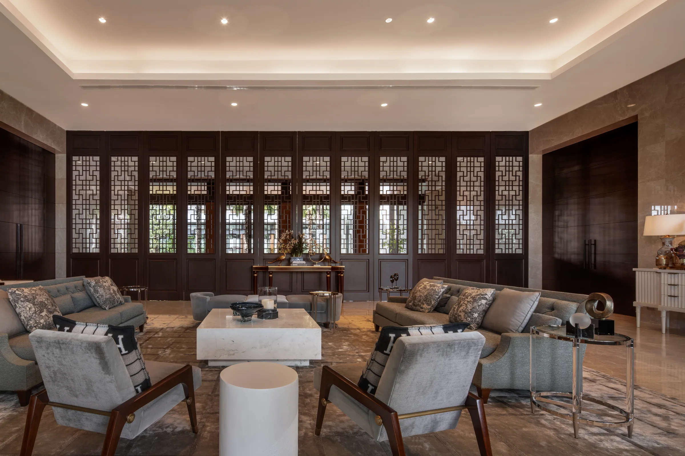 Dining room 1 at Khon Kaen Residence — formal dining with cream walls and dark fretwork.