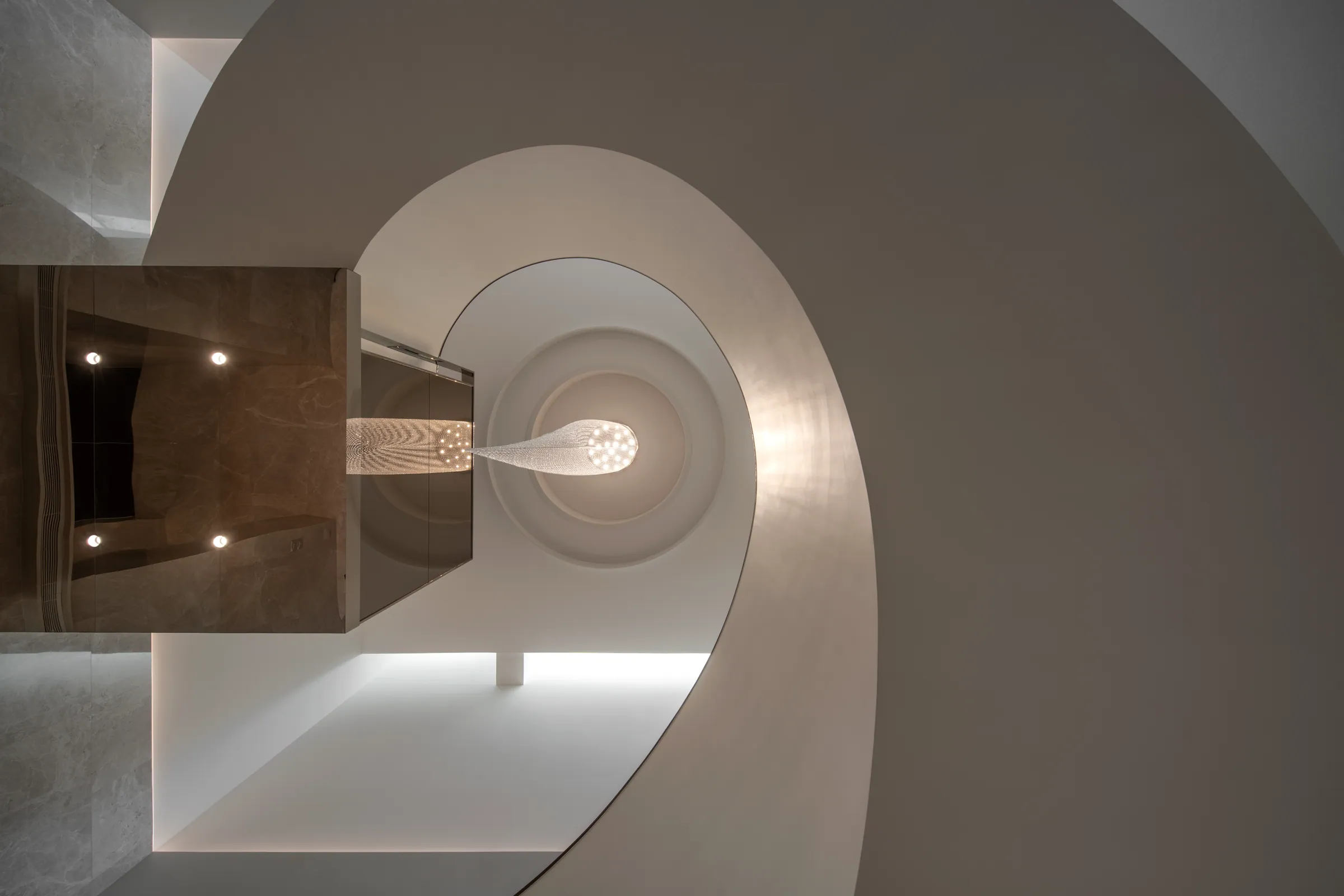Upper-landing view of the staircase at Khon Kaen Residence.