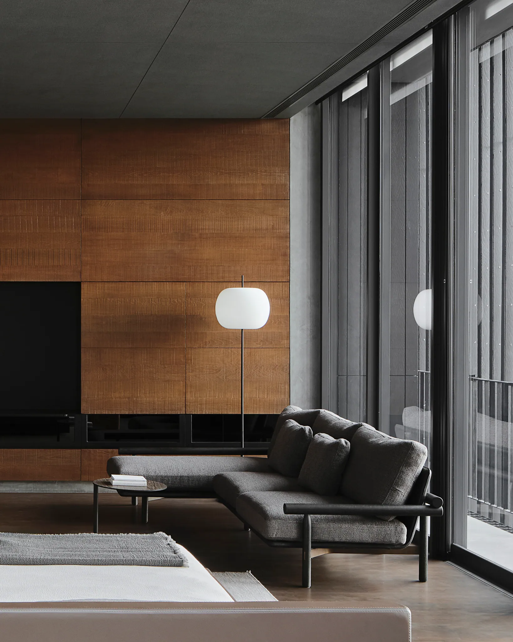 Walk-in closet at Black Box Project — rich timber frames, museum lighting on white garments.