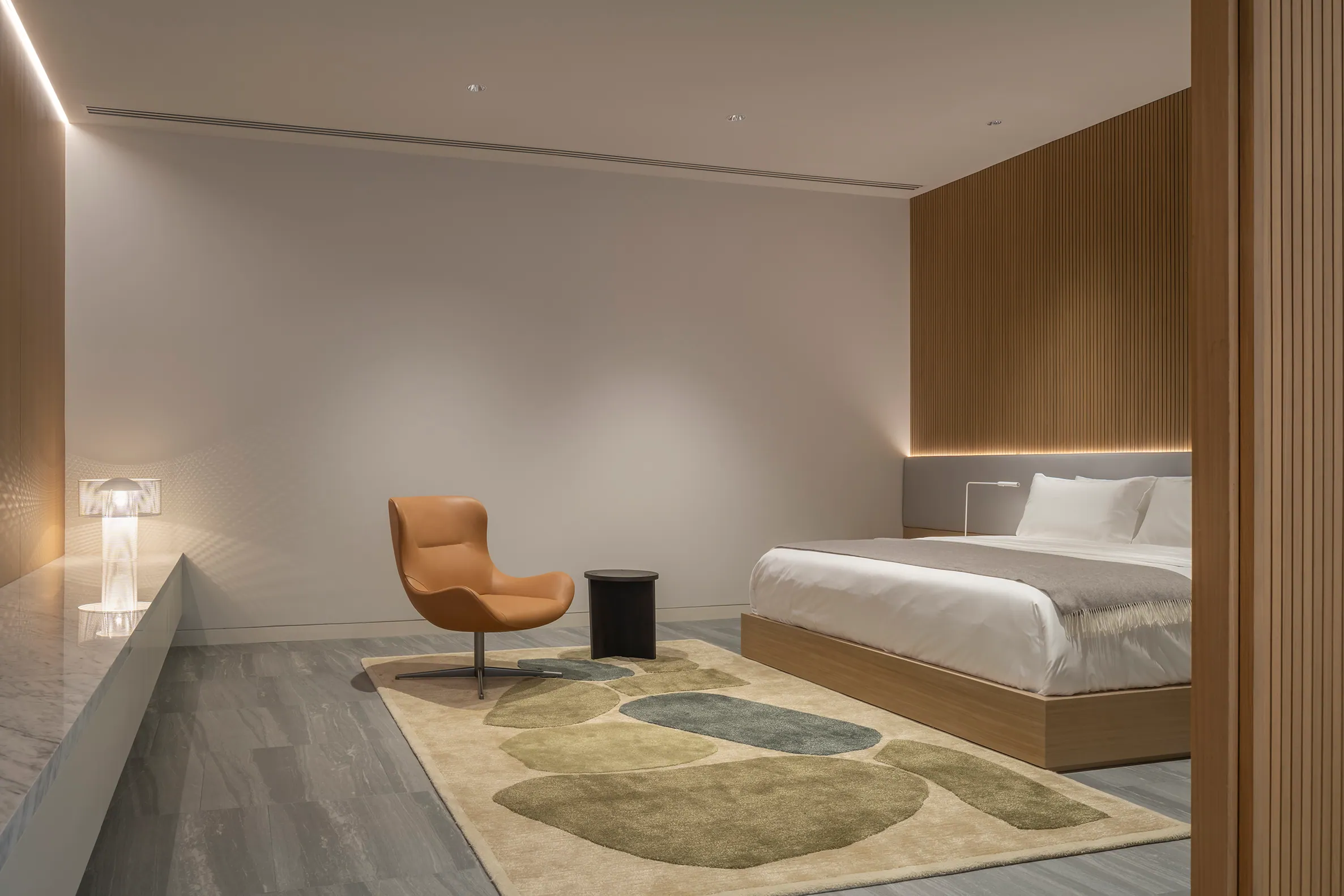 Master bedroom detail — bedframe with backlit headwall.
