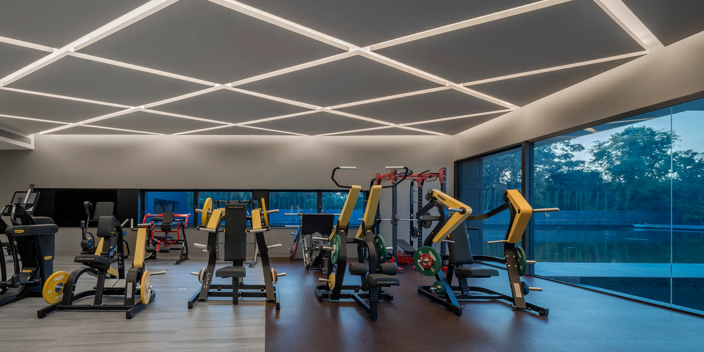 Fitness ceiling detail at Water House — modular recessed lighting grid.