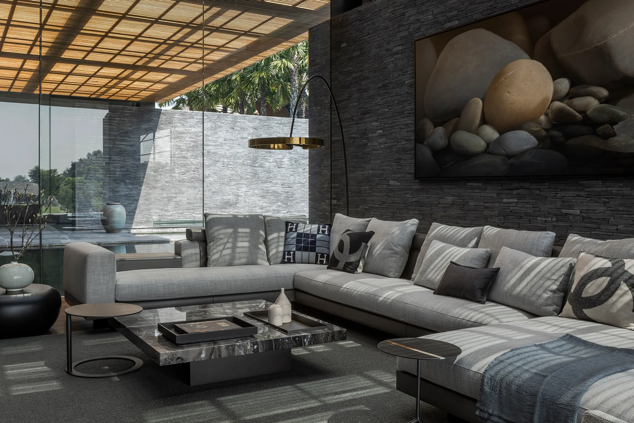 Multi-view lounge at Water House — wood beam ceiling, complex sectional, daylight.