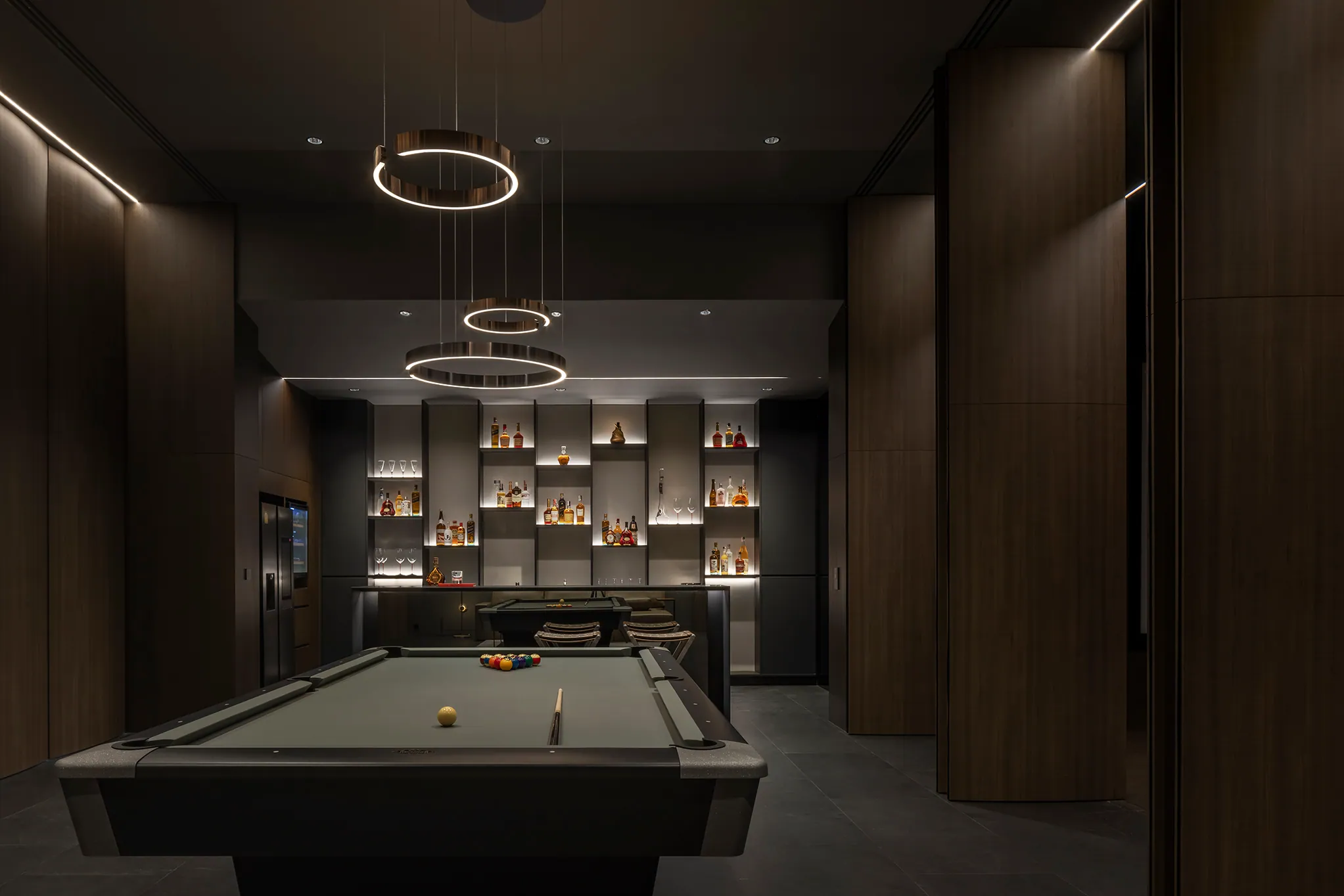 Billiards alternate angle at Water House — multiple hanging pendants, premium spirit collection.